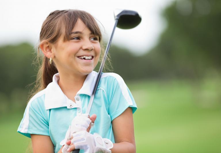 young girl with a golf club