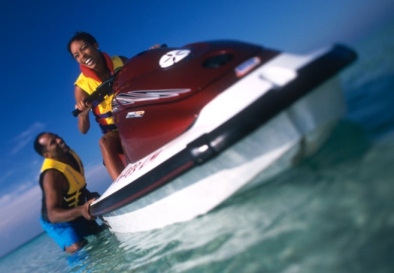 a couple getting on a waverunner