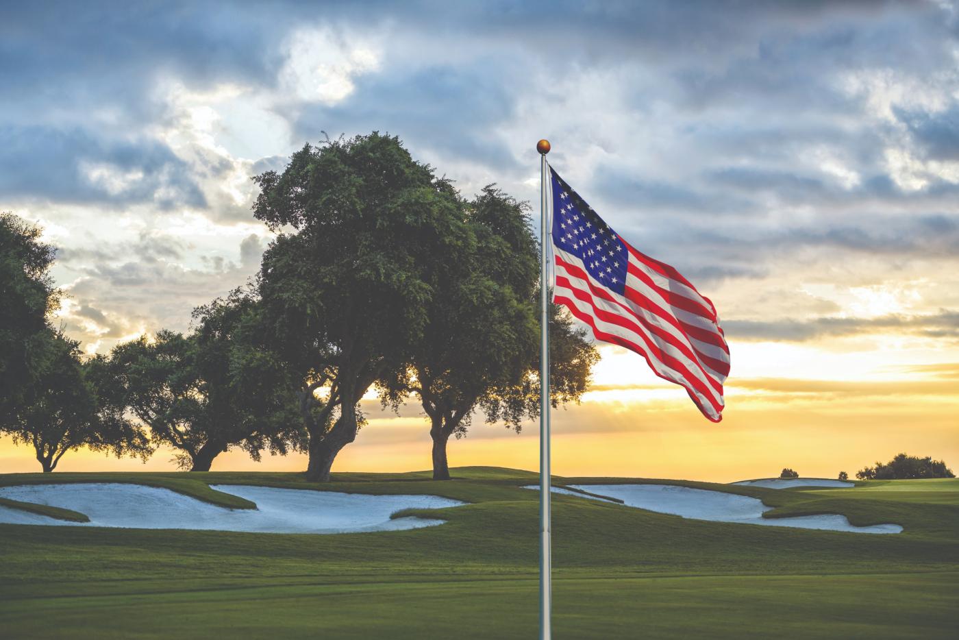 golf course with the American flag in the foreground