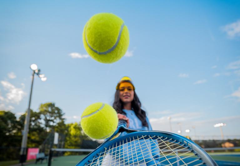 woman holding tennis racquet 