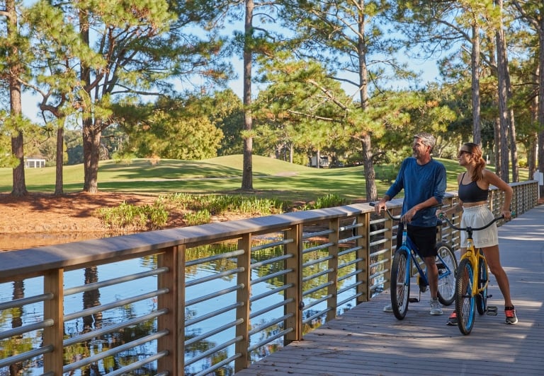 Couple biking on resort