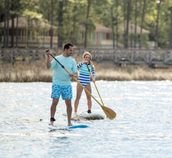 couple paddle boarding